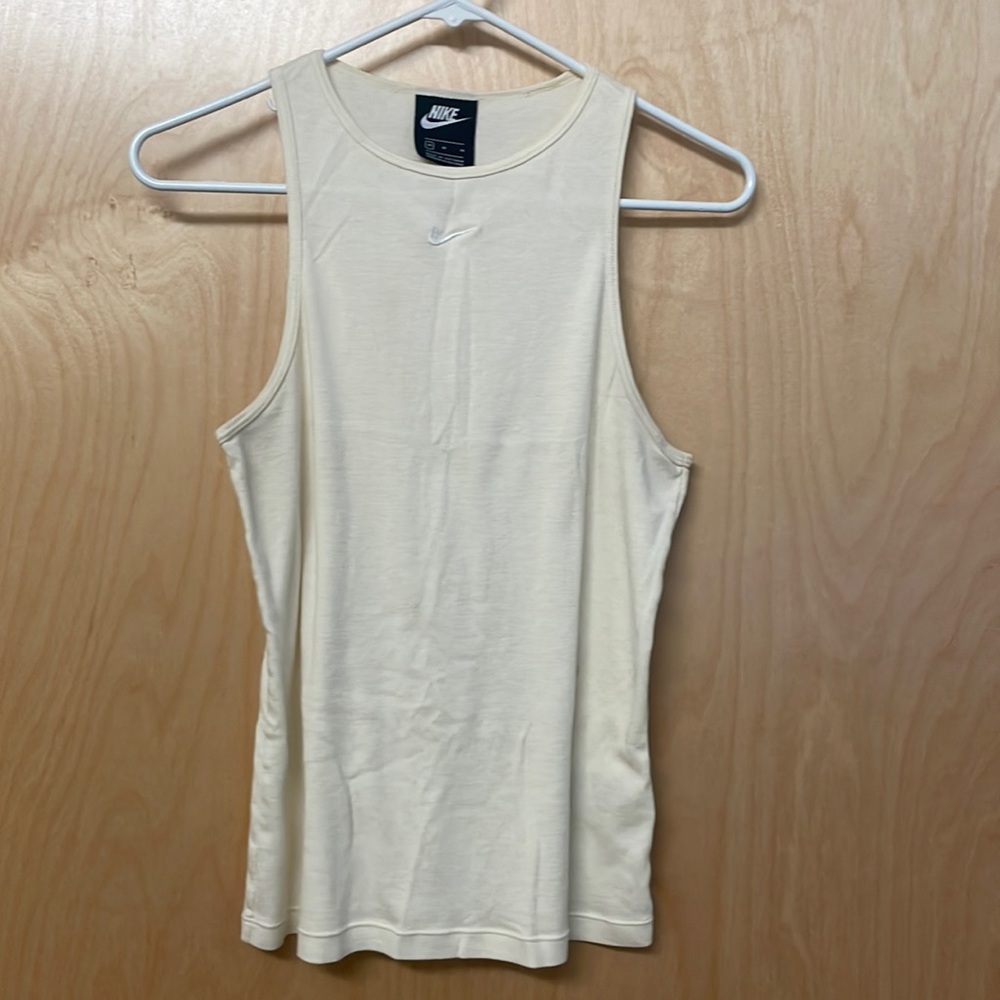 Medium NIKE light yellow, tank top. Great condition.